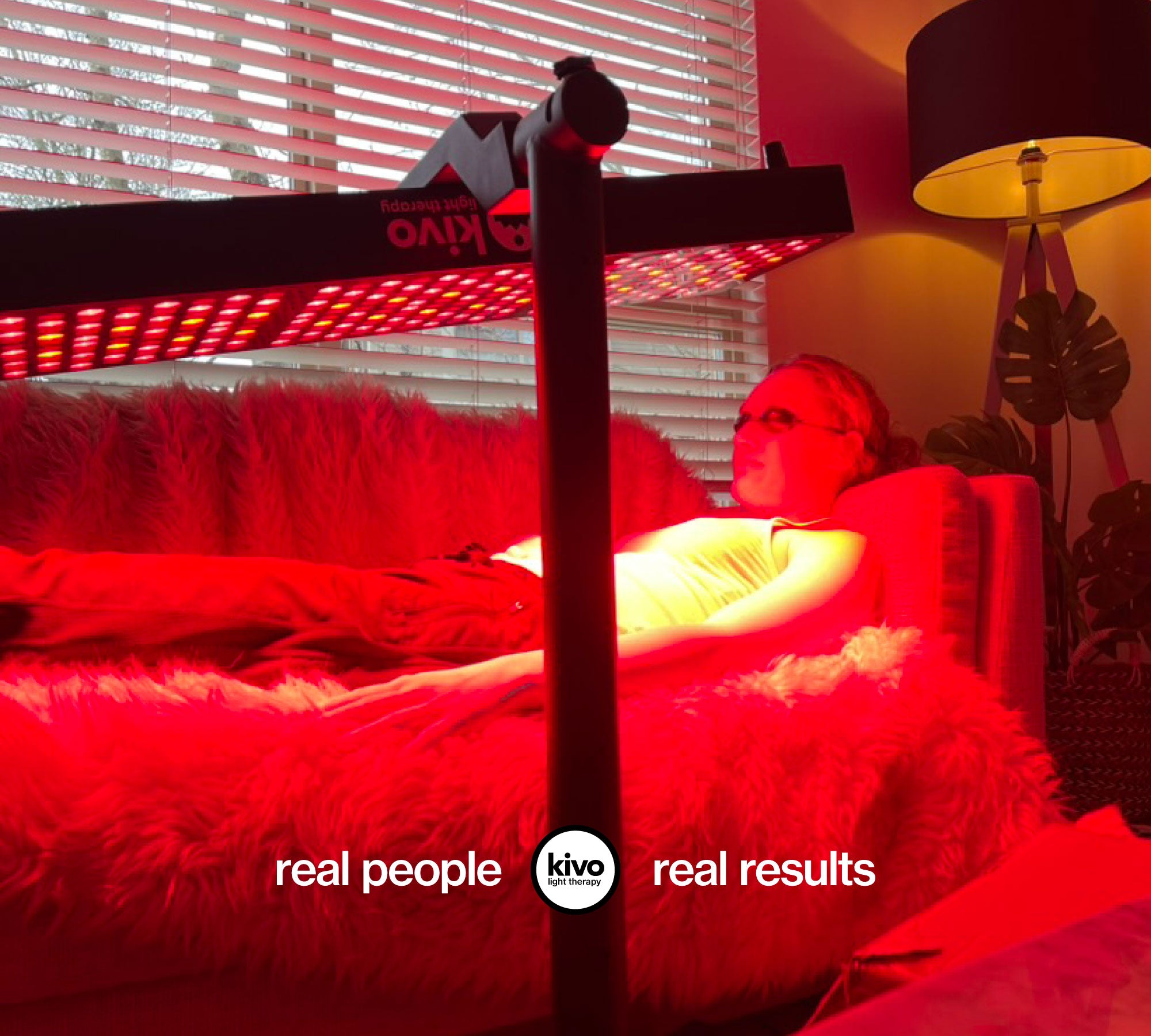 Person lying on a bed with red lighting, Kivo branded equipment, and 'real people real results' text.